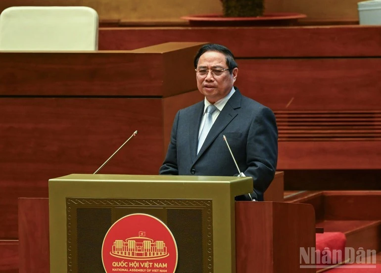Prime Minister Pham Minh Chinh presents the action plan for implementing the Resolution of the 14th National Party Congress at the conference on February 7. (Photo: NDO)